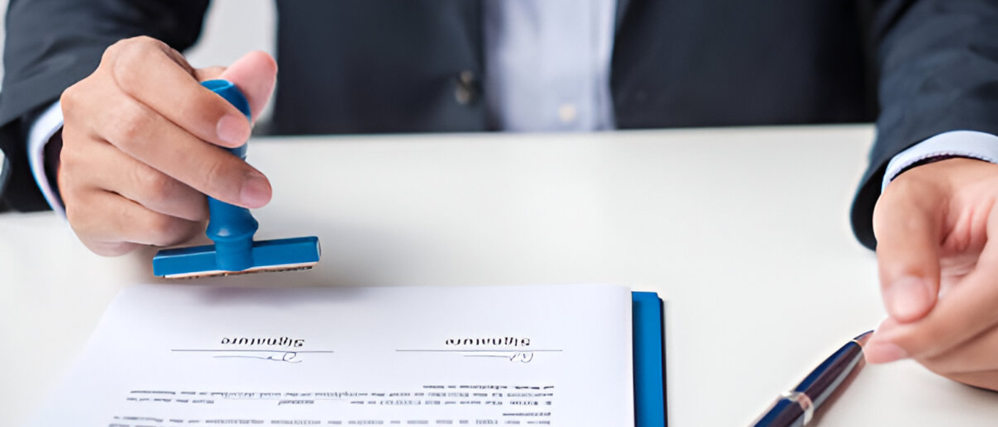 Man signing paper - Criminal Justice Header Legal Studies vs Legal Services