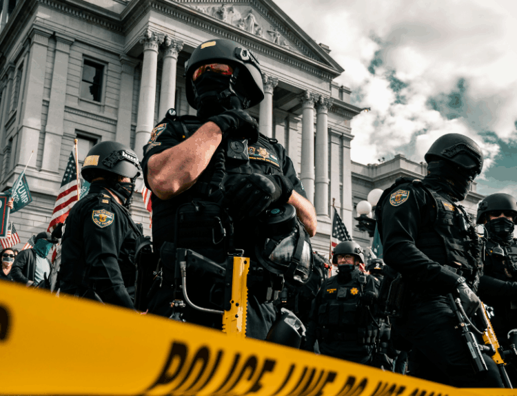police cordoning protesters